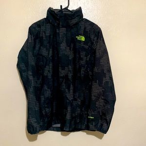 Kids size XL black/digital The North Face wind breaker with foldable hood.